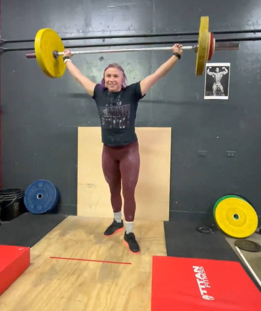 A potato-quality image of me extremely happy after a hard-earned snatch PR. My shirt says, &ldquo;It&rsquo;s Britney, b*tch,&rdquo; which I wore to celebrate Britney Spears&rsquo; then recent release from her conservatorship. I love the juxtaposition here: cheering the newfound freedom of a beloved celebrity of my childhood — another victim of early-to-mid-aughts culture — and a visual depiction of the mental freedom I found in the sport of olympic weightlifting.